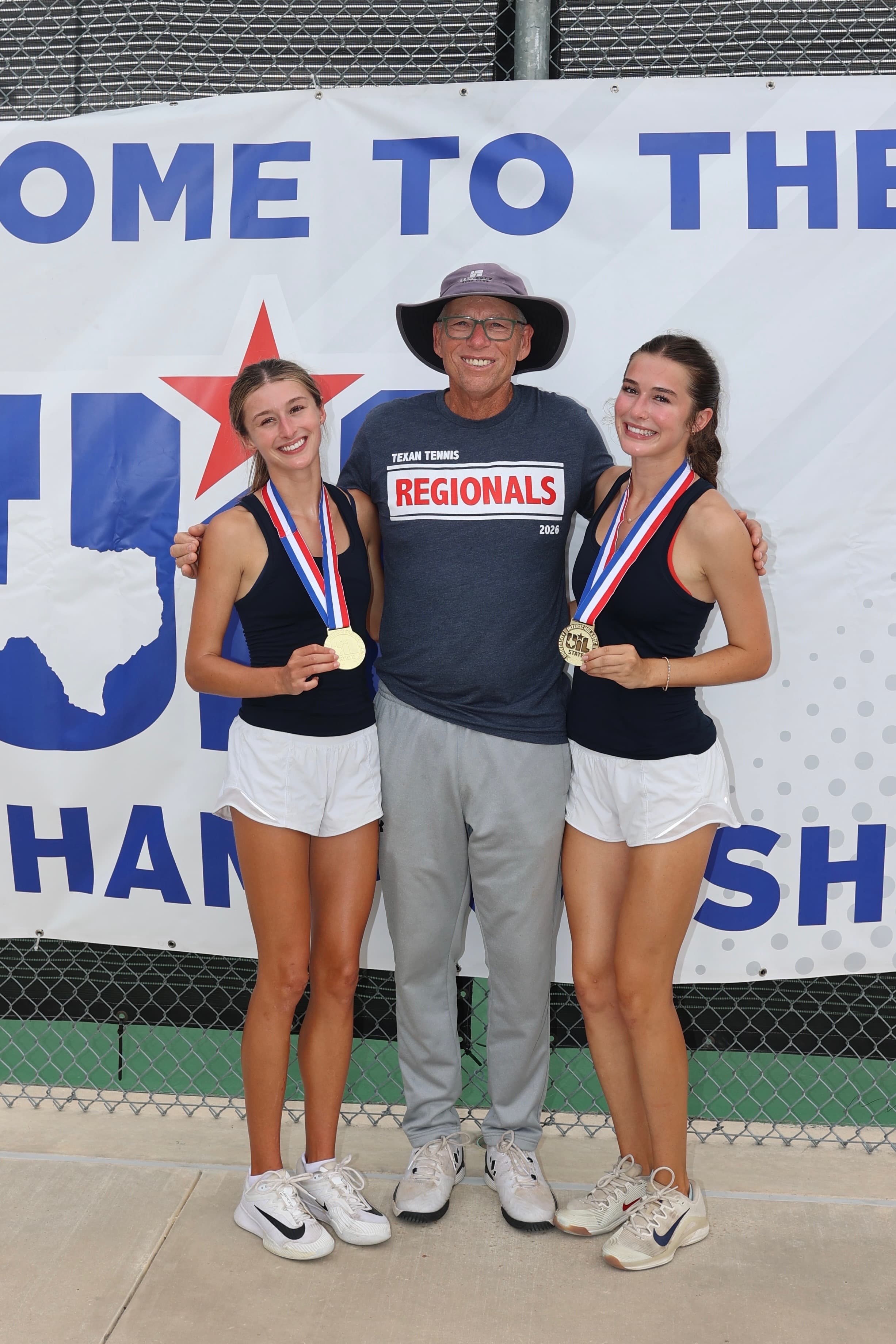Roger Watson with a tennis student